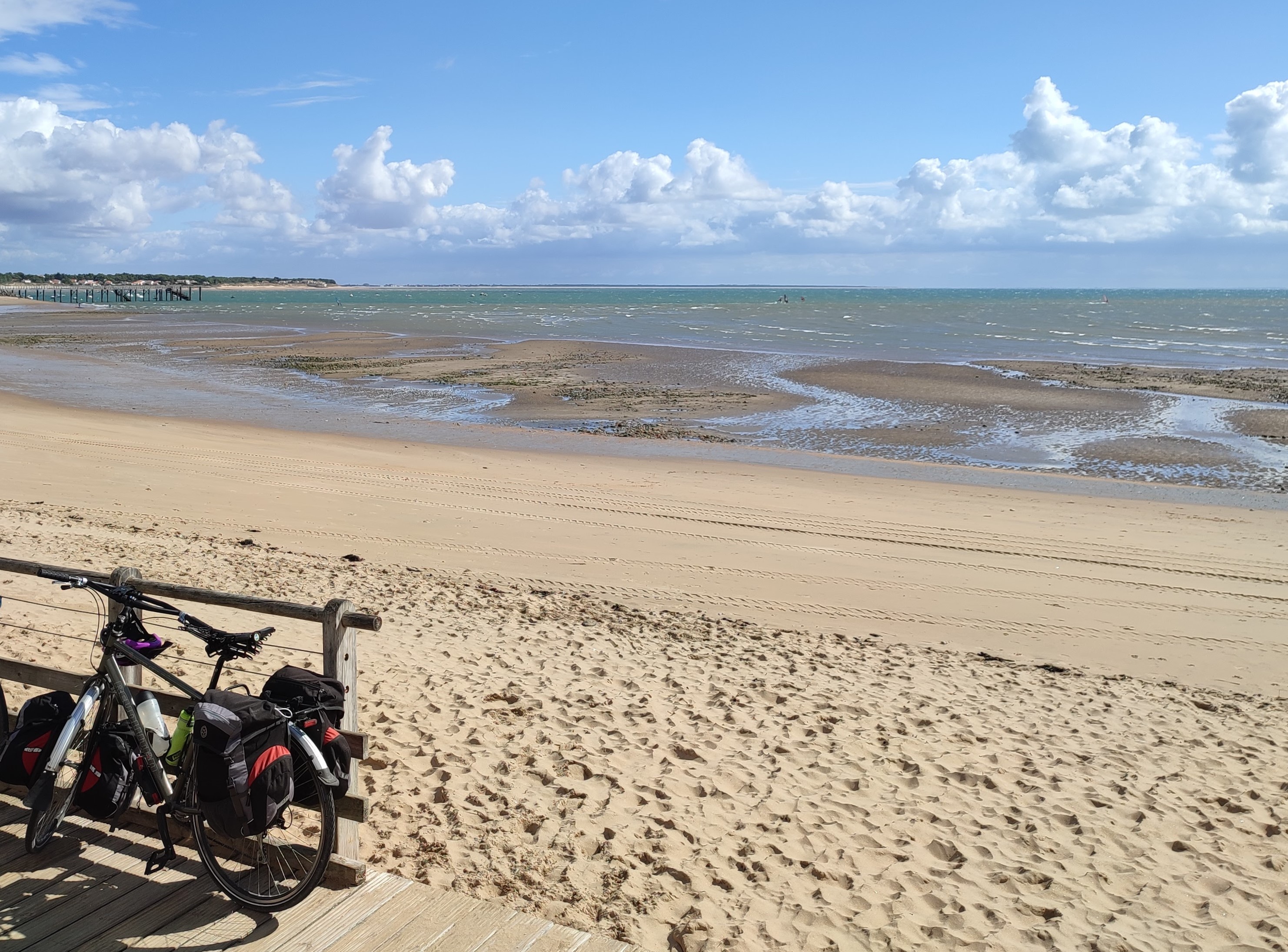 My set up on the cycle tour in France Image of a touring bike with manta saddle with a beach in the background